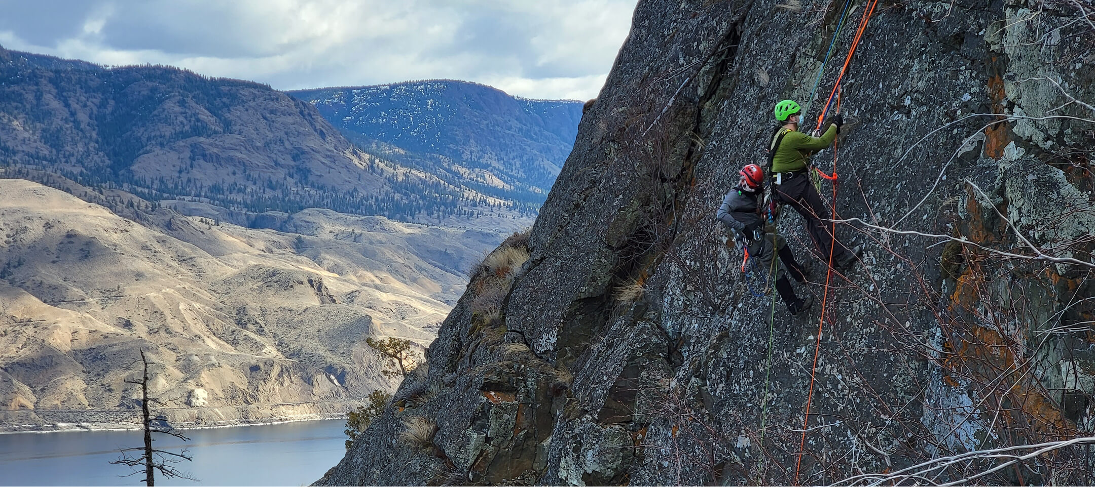 Kamloops Search and Rescue members rock climbing during technical rope rescue training above Thompson River valley